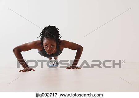 Stock Photo - Woman Doing Push-Up. Fotosearch