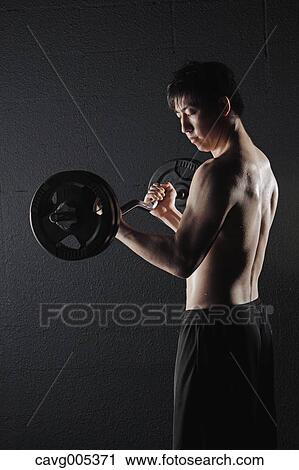 Stock Image - Young Male Athlete Training. Fotosearch