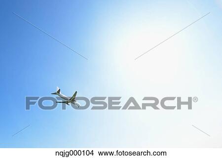 Picture - Airplane flying in the sky. Fotosearch