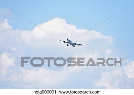 Airplane flying in the sky View Large Photo Image Stock Image - Airplane flying in the sky. Fotosearch