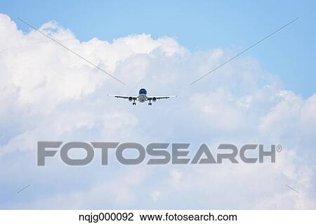 Airplane flying in the sky View Large Photo Image Stock Image - Airplane flying in the sky. Fotosearch