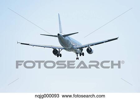 Airplane flying in the sky View Large Photo Image Stock Image - Airplane flying in the sky. Fotosearch