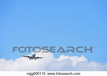 Airplane flying in the sky View Large Photo Image Stock Image - Airplane flying in the sky. Fotosearch