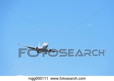 Airplane flying in the sky View Large Photo Image Stock Image - Airplane flying in the sky. Fotosearch