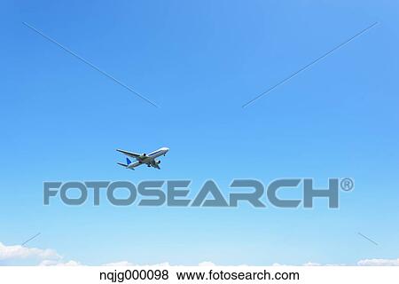Airplane flying in the sky View Large Photo Image Stock Photo - Airplane flying in the sky. Fotosearch
