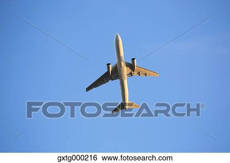 Airplane flying in the sky View Large Photo Image Stock Photograph - Airplane flying in the sky. Fotosearch