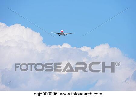 Airplane flying in the sky View Large Photo Image Stock Photograph - Airplane flying in the sky. Fotosearch