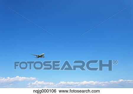 Airplane flying in the sky View Large Photo Image Stock Photograph - Airplane flying in the sky. Fotosearch