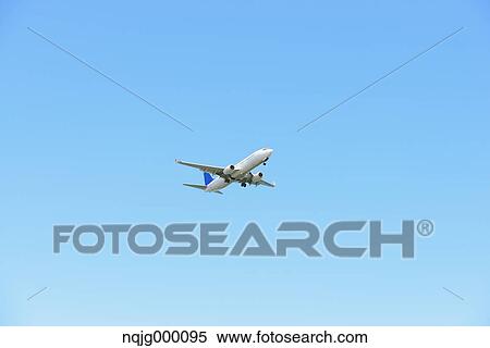 Airplane flying in the sky View Large Photo Image Stock Photography - Airplane flying in the sky. Fotosearch