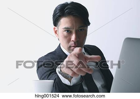 Picture - Angry Japanese businessman. Fotosearch