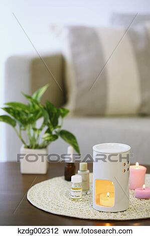 Stock Image - Aroma candles and essence. Fotosearch