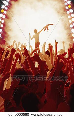 Stock Image - Audience enjoying live concert. Fotosearch