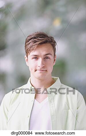 Caucasian young man looking at camera View Large Photo Image Picture - Caucasian young man looking at camera. Fotosearch