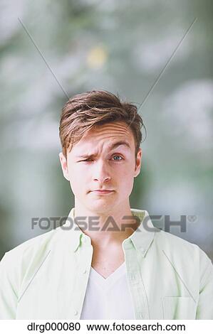 Stock Image - Caucasian young man looking at camera. Fotosearch