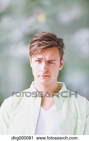 Caucasian young man looking at camera View Large Photo Image Stock Image - Caucasian young man looking at camera. Fotosearch