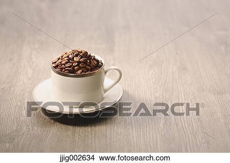 Picture - Coffee beans in a cup. Fotosearch