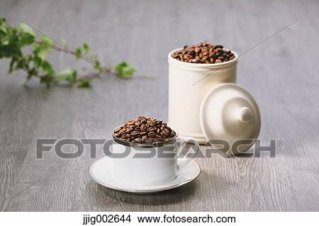 Coffee beans in a cup View Large Photo Image Picture - Coffee beans in a cup. Fotosearch