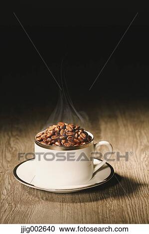 Stock Image - Coffee beans in a cup. Fotosearch