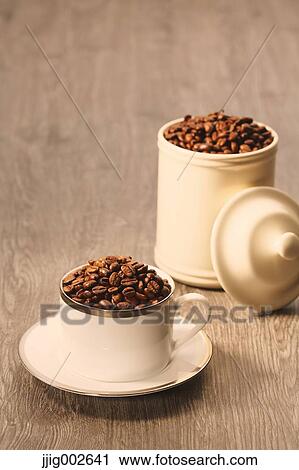 Coffee beans in a cup View Large Photo Image Stock Image - Coffee beans in a cup. Fotosearch