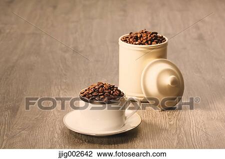 Coffee beans in a cup View Large Photo Image Stock Image - Coffee beans in a cup. Fotosearch