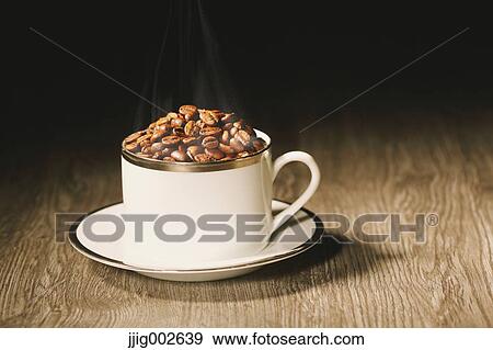 Coffee beans in a cup View Large Photo Image Stock Photo - Coffee beans in a cup. Fotosearch