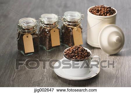Coffee beans in a cup View Large Photo Image Stock Photo - Coffee beans in a cup. Fotosearch