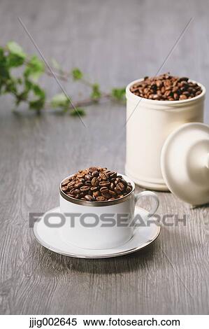 Coffee beans in a cup View Large Photo Image Stock Photography - Coffee beans in a cup. Fotosearch