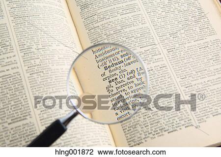 Dictionary and magnifying glass View Large Photo Image Stock Image - Dictionary and magnifying glass. Fotosearch