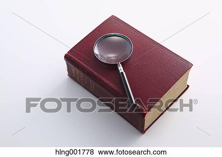 Dictionary and magnifying glass View Large Photo Image Stock Photo - Dictionary and magnifying glass. Fotosearch