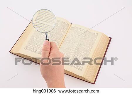 Dictionary and magnifying glass View Large Photo Image Stock Photograph - Dictionary and magnifying glass. Fotosearch