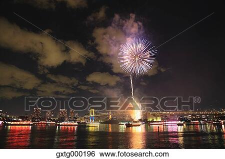 Stock Photograph - Fireworks in Odaiba bay, Tokyo, Japan. Fotosearch
