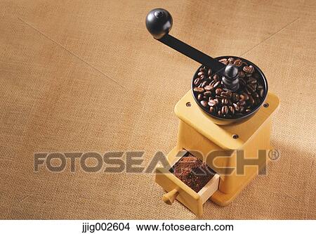 Hand-grinding coffee mill View Large Photo Image Picture - Hand-grinding coffee mill. Fotosearch