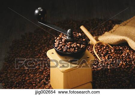 Hand-grinding coffee mill View Large Photo Image Picture - Hand-grinding coffee mill. Fotosearch