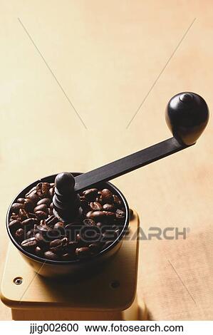 Stock Image - Hand-grinding coffee mill. Fotosearch