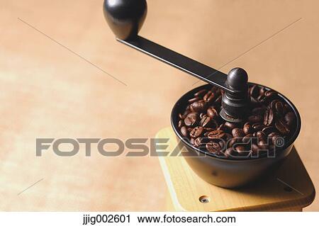 Hand-grinding coffee mill View Large Photo Image Stock Image - Hand-grinding coffee mill. Fotosearch