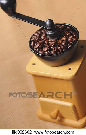 Hand-grinding coffee mill View Large Photo Image Stock Image - Hand-grinding coffee mill. Fotosearch