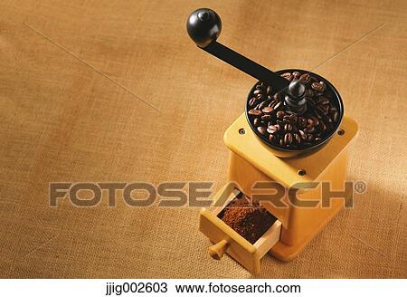 Hand-grinding coffee mill View Large Photo Image Stock Image - Hand-grinding coffee mill. Fotosearch