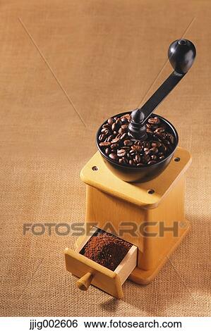 Hand-grinding coffee mill View Large Photo Image Stock Photograph - Hand-grinding coffee mill. Fotosearch