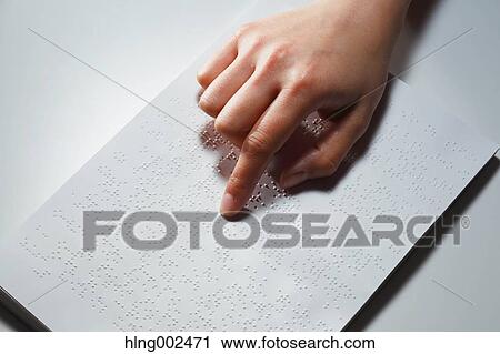 Hand reading Braille paper View Large Photo Image Stock Image - Hand reading Braille paper. Fotosearch