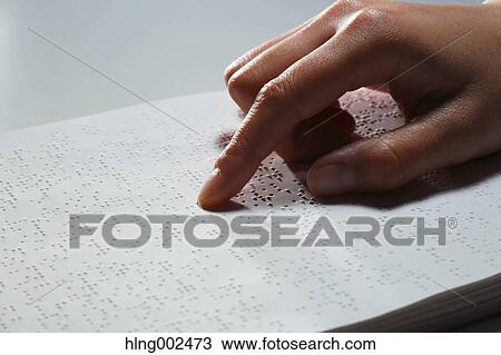 Hand reading Braille paper View Large Photo Image Stock Image - Hand reading Braille paper. Fotosearch