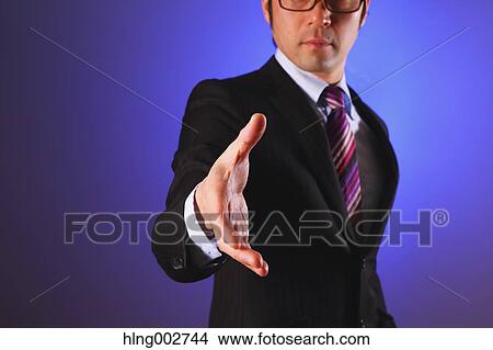 Japanese businessman giving hand View Large Photo Image Picture - Japanese businessman giving hand. Fotosearch
