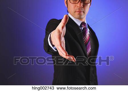 Japanese businessman giving hand View Large Photo Image Stock Image - Japanese businessman giving hand. Fotosearch
