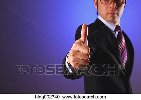 Japanese businessman giving the thumbs-up View Large Photo Image Stock Image - Japanese businessman giving the thumbs-up. Fotosearch