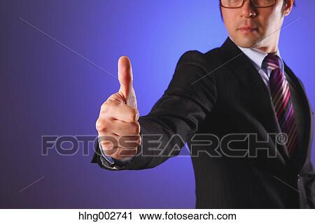 Japanese businessman giving the thumbs-up View Large Photo Image Stock Image - Japanese businessman giving the thumbs-up. Fotosearch