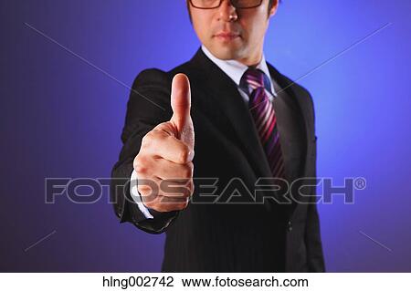 Japanese businessman giving the thumbs-up View Large Photo Image Stock Image - Japanese businessman giving the thumbs-up. Fotosearch