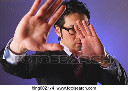 Japanese businessman giving the stop sign View Large Photo Image Picture - Japanese businessman giving the stop sign. Fotosearch