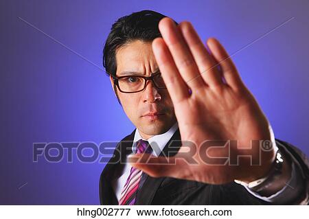 Japanese businessman giving the stop sign View Large Photo Image Stock Photo - Japanese businessman giving the stop sign. Fotosearch