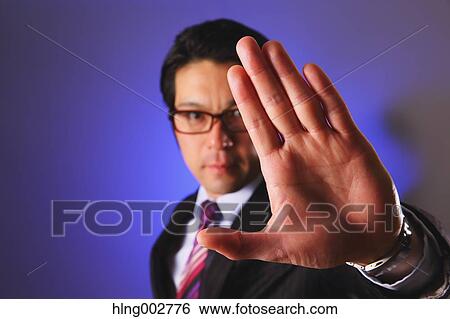 Japanese businessman giving the stop sign View Large Photo Image Stock Photograph - Japanese businessman giving the stop sign. Fotosearch