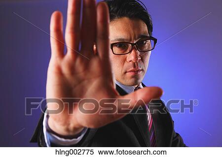 Japanese businessman giving the stop sign View Large Photo Image Stock Photography - Japanese businessman giving the stop sign. Fotosearch