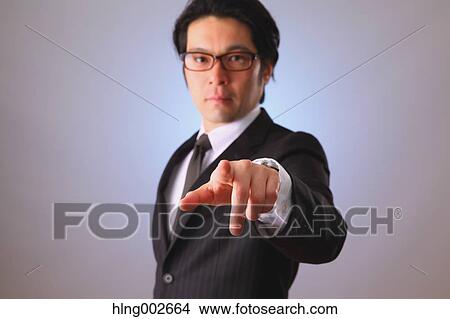 Japanese businessman using virtual reality device View Large Photo Image Picture - Japanese businessman using virtual reality device. Fotosearch